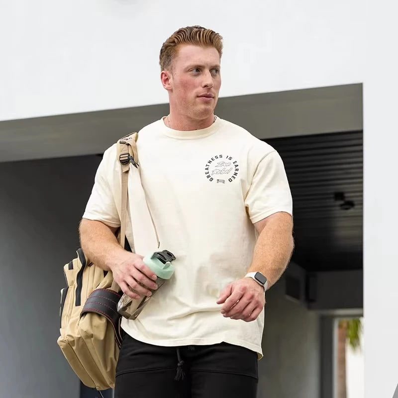 Apex Ritual – Earned Not Given Men's Gym T-Shirt – Bold Text Oversized Crew Neck Lifting Tee